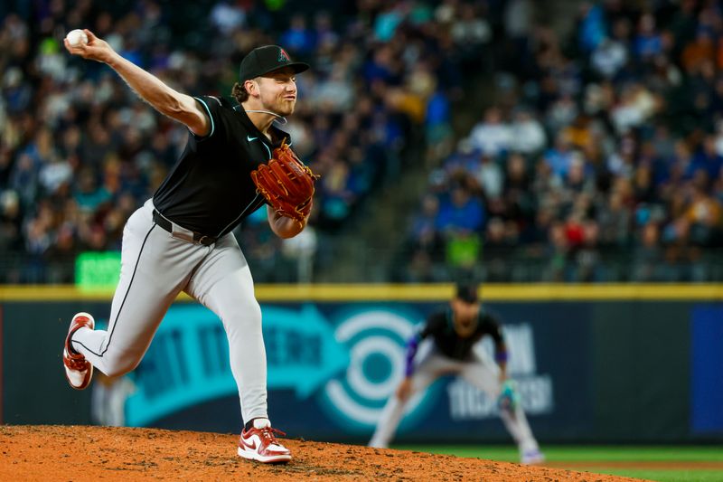 Apr 28, 2024; Seattle, Washington, USA; Arizona Diamondbacks starting pitcher Brandon Pfaadt (32) throws against the Seattle Mariners during the fourth inning at T-Mobile Park. Mandatory Credit: Joe Nicholson-USA TODAY Sports