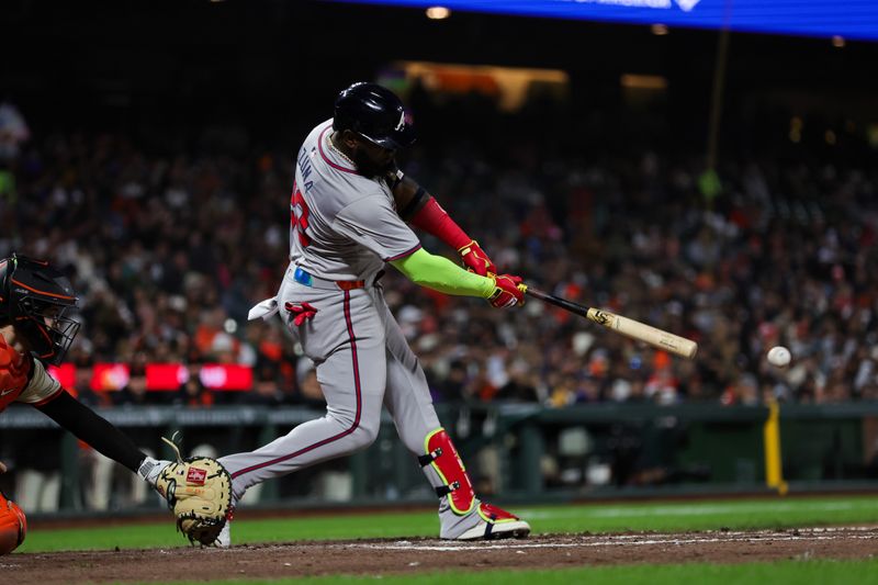 Aug 12, 2024; San Francisco, California, USA; Atlanta Braves designated hitter Marcell Ozuna (20) hits a double during the seventh inning against the San Francisco Giants at Oracle Park. Mandatory Credit: Sergio Estrada-USA TODAY Sports