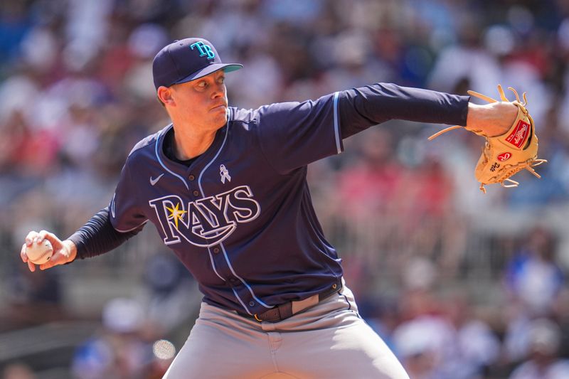Jun 16, 2024; Cumberland, Georgia, USA; Tampa Bay Rays relief pitcher Pete Fairbanks (29) pitches against the Atlanta Braves during the ninth inning at Truist Park. Mandatory Credit: Dale Zanine-USA TODAY Sports