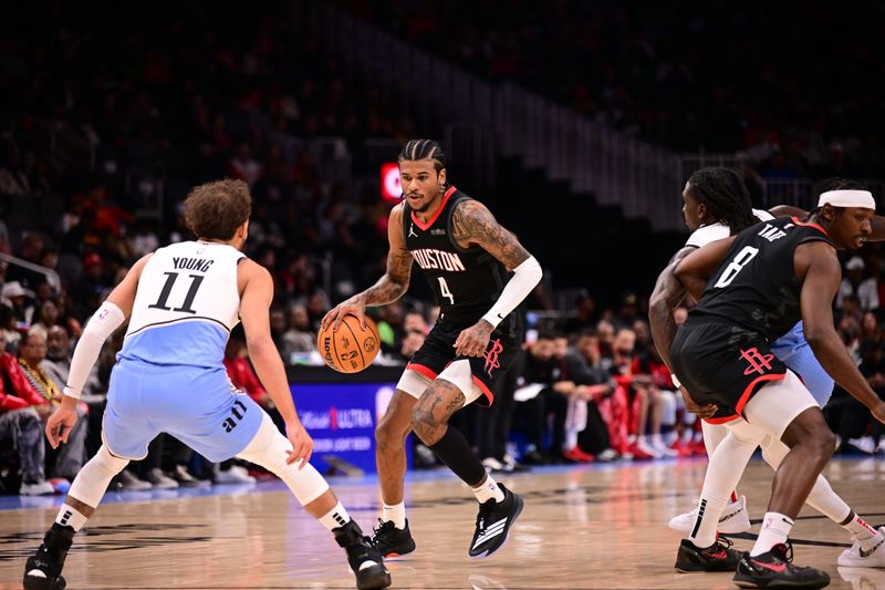 ATLANTA, GA - JANUARY 28: Jalen Green #4 of the Houston Rockets handles the ball during the game against the Atlanta Hawks on January 28, 2025 at State Farm Arena in Atlanta, Georgia.  NOTE TO USER: User expressly acknowledges and agrees that, by downloading and/or using this Photograph, user is consenting to the terms and conditions of the Getty Images License Agreement. Mandatory Copyright Notice: Copyright 2025 NBAE (Photo by Adam Hagy/NBAE via Getty Images)