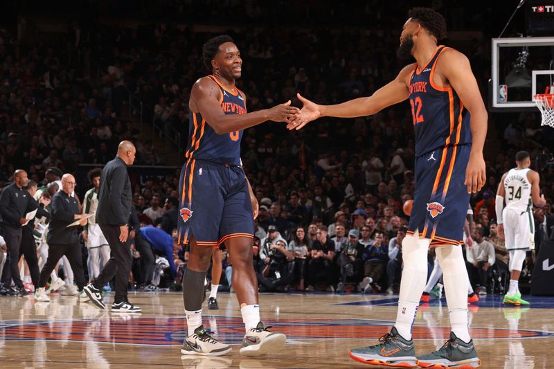 NEW YORK, NY - NOVEMBER 8: OG Anunoby #8 high fives Karl-Anthony Towns #32 of the New York Knicks during the game against the Milwaukee Bucks on November 8, 2024 at Madison Square Garden in New York City, New York.  NOTE TO USER: User expressly acknowledges and agrees that, by downloading and or using this photograph, User is consenting to the terms and conditions of the Getty Images License Agreement. Mandatory Copyright Notice: Copyright 2024 NBAE  (Photo by Nathaniel S. Butler/NBAE via Getty Images)