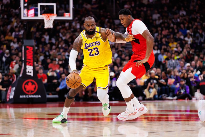 TORONTO, CANADA - NOVEMBER 1: LeBron James #23 of the Los Angeles Lakers dribbles against RJ Barrett #9 of the Toronto Raptors during the first half of their NBA game at Scotiabank Arena on November 1, 2024 in Toronto, Canada. NOTE TO USER: User expressly acknowledges and agrees that, by downloading and or using this photograph, User is consenting to the terms and conditions of the Getty Images License Agreement. (Photo by Cole Burston/Getty Images)