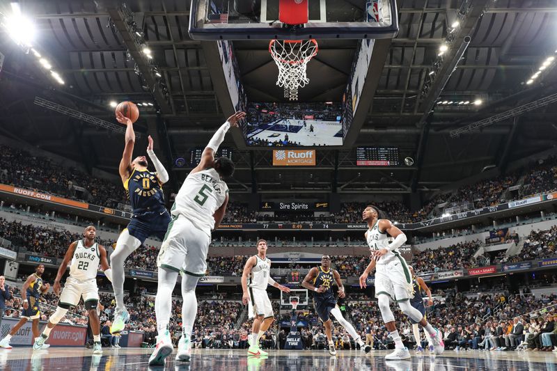 INDIANAPOLIS, IN - JANUARY 3: Tyrese Haliburton #0 of the Indiana Pacers drives to the basket during the game against the Milwaukee Bucks on January 3, 2024 at Gainbridge Fieldhouse in Indianapolis, Indiana. NOTE TO USER: User expressly acknowledges and agrees that, by downloading and or using this Photograph, user is consenting to the terms and conditions of the Getty Images License Agreement. Mandatory Copyright Notice: Copyright 2024 NBAE (Photo by Jeff Haynes/NBAE via Getty Images)