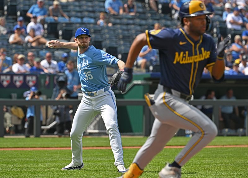 May 8, 2024; Kansas City, Missouri, USA;  Kansas City Royals relief pitcher Chris Stratton (35) throws out Milwaukee Brewers Jackson Chourio (right) at first base in the eighth inning at Kauffman Stadium. Mandatory Credit: Peter Aiken-USA TODAY Sports