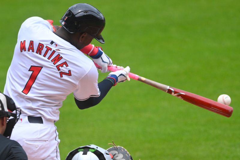 Jul 4, 2024; Cleveland, Ohio, USA; Cleveland Guardians center fielder Angel Martinez (1) singles in the first inning against the Chicago White Sox at Progressive Field. Mandatory Credit: David Richard-USA TODAY Sports