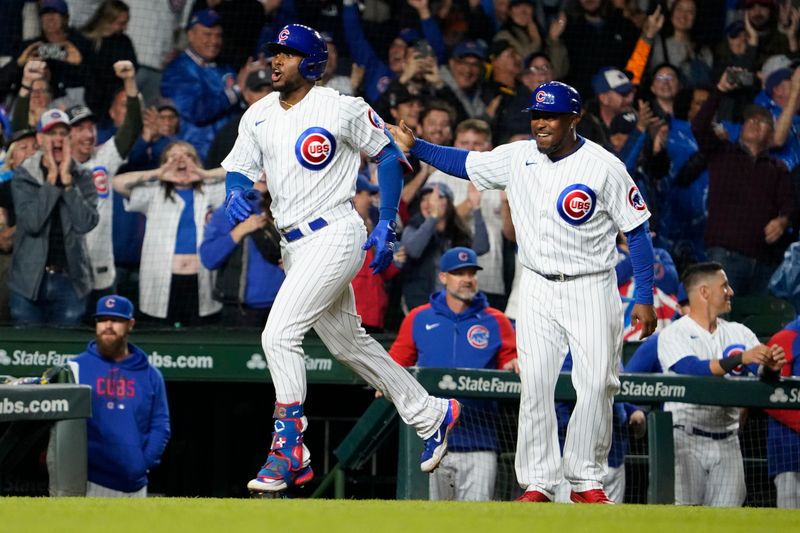 Sep 19, 2023; Chicago, Illinois, USA; Chicago Cubs designated hitter Alexander Canario (4) runs the bases after hitting a grand slam home run against the Pittsburgh Pirates during the eighth inning at Wrigley Field. Mandatory Credit: David Banks-USA TODAY Sports