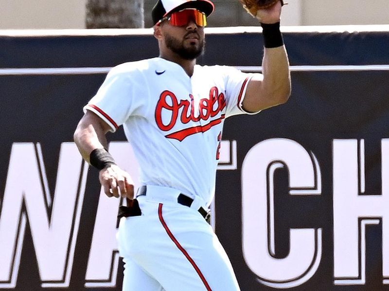 Feb 27, 2023; Sarasota, Florida, USA; Baltimore Orioles right fielder Anthony Santander (25) catches a fly ball in the second inning against the Tampa Bay Rays at Ed Smith Stadium. Mandatory Credit: Jonathan Dyer-USA TODAY Sports