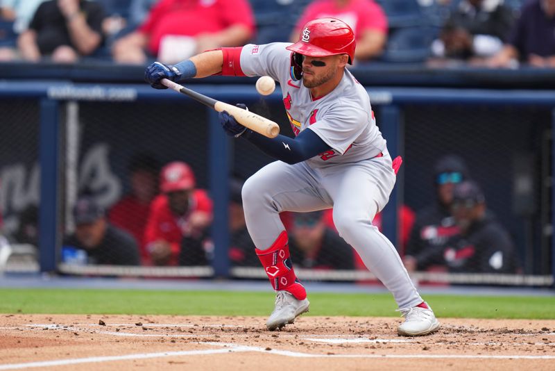 Mar 4, 2025; West Palm Beach, Florida, USA; St. Louis Cardinals outfielder Michael Siani (22) attempts a bunt against the Washington Nationals during the third inning at CACTI Park of the Palm Beaches. Mandatory Credit: Rich Storry-Imagn Images