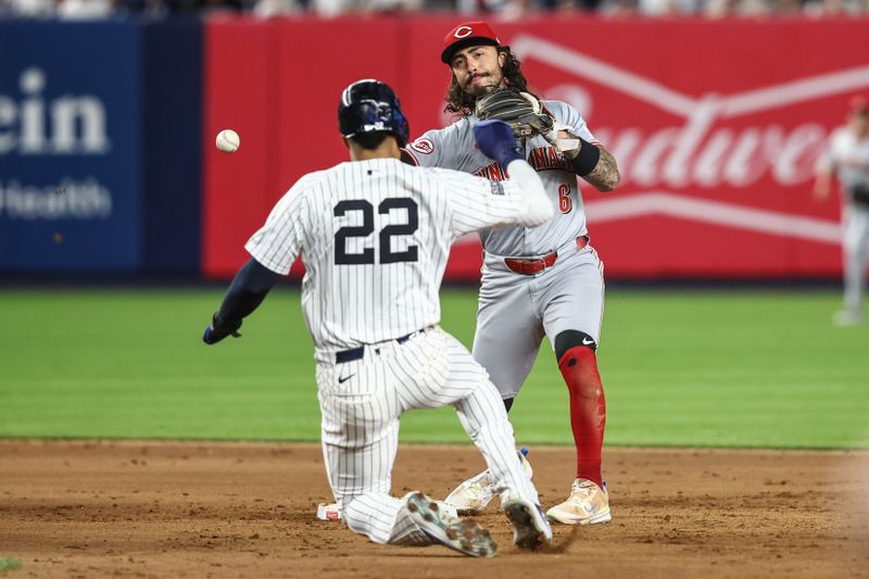 Jul 3, 2024; Bronx, New York, USA; Cincinnati Reds second baseman Jonathan India (6) throws past New York Yankees right fielder Juan Soto (22) to complete a double play in the seventh inning at Yankee Stadium. Mandatory Credit: Wendell Cruz-USA TODAY Sports