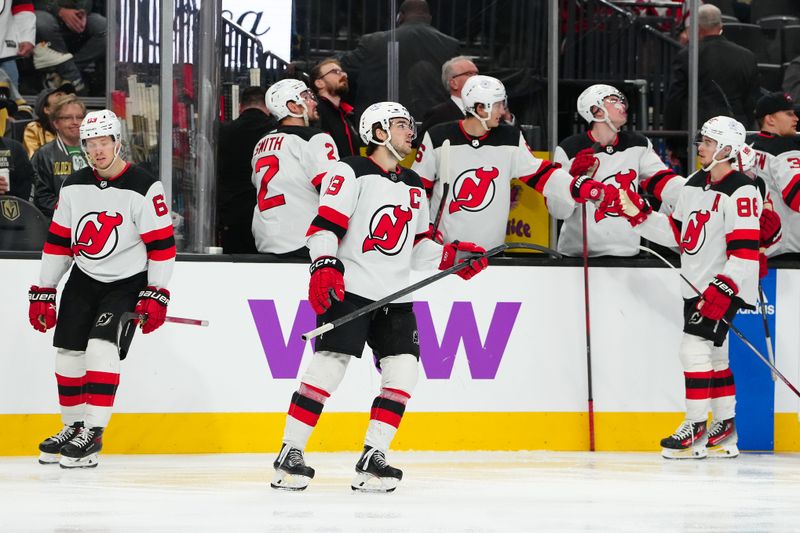 Mar 17, 2024; Las Vegas, Nevada, USA; New Jersey Devils center Nico Hischier (13) celebrates with team mates after scoring a goal against the Vegas Golden Knights during the third period at T-Mobile Arena. Mandatory Credit: Stephen R. Sylvanie-USA TODAY Sports