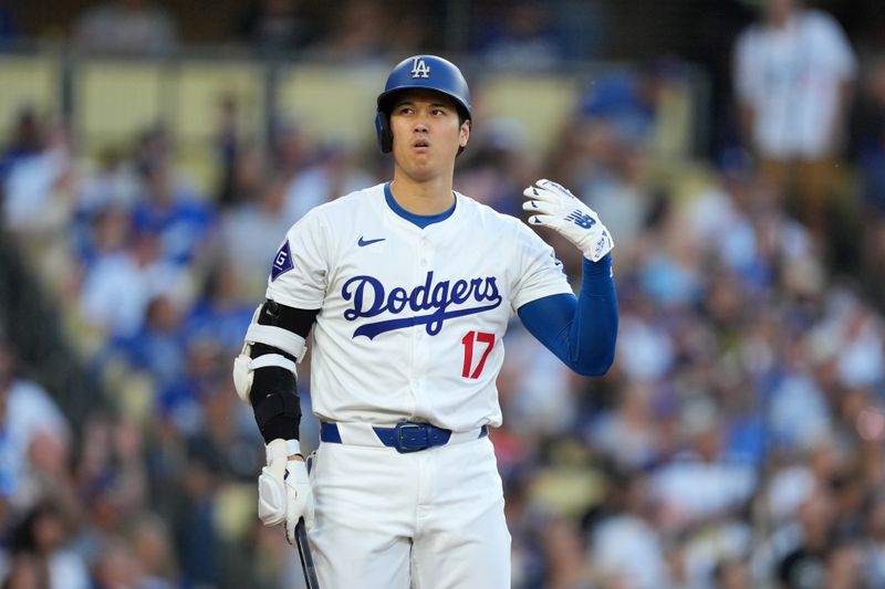 Jun 15, 2024; Los Angeles, California, USA; Los Angeles Dodgers designated hitter Shohei Ohtani (17) reacts in the seventh inning against the Kansas City Royals at Dodger Stadium. Mandatory Credit: Kirby Lee-USA TODAY Sports