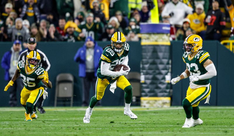 Green Bay Packers safety Xavier McKinney (29) runs after an interception during a NFL football game against the San Francisco 49ers Sunday, Nov. 24, 2024, in Green Bay, Wis. (AP Photo/Jeffrey Phelps