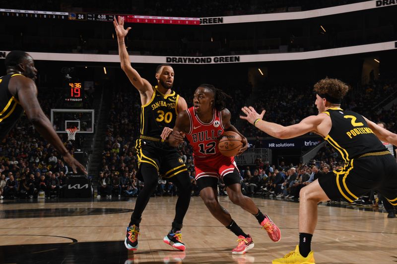 SAN FRANCISCO, CA - MARCH 7:  Ayo Dosunmu #12 of the Chicago Bulls handles the ball during the game against the Golden State Warriors on March 7, 2024 at Chase Center in San Francisco, California. NOTE TO USER: User expressly acknowledges and agrees that, by downloading and or using this photograph, user is consenting to the terms and conditions of Getty Images License Agreement. Mandatory Copyright Notice: Copyright 2024 NBAE (Photo by Noah Graham/NBAE via Getty Images)