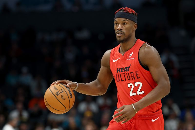 CHARLOTTE, NORTH CAROLINA - NOVEMBER 27: Jimmy Butler #22 of the Miami Heat dribbles during the second half of the game against the Charlotte Hornets at Spectrum Center on November 27, 2024 in Charlotte, North Carolina. NOTE TO USER: User expressly acknowledges and agrees that, by downloading and or using this photograph, User is consenting to the terms and conditions of the Getty Images License Agreement. (Photo by Jared C. Tilton/Getty Images)