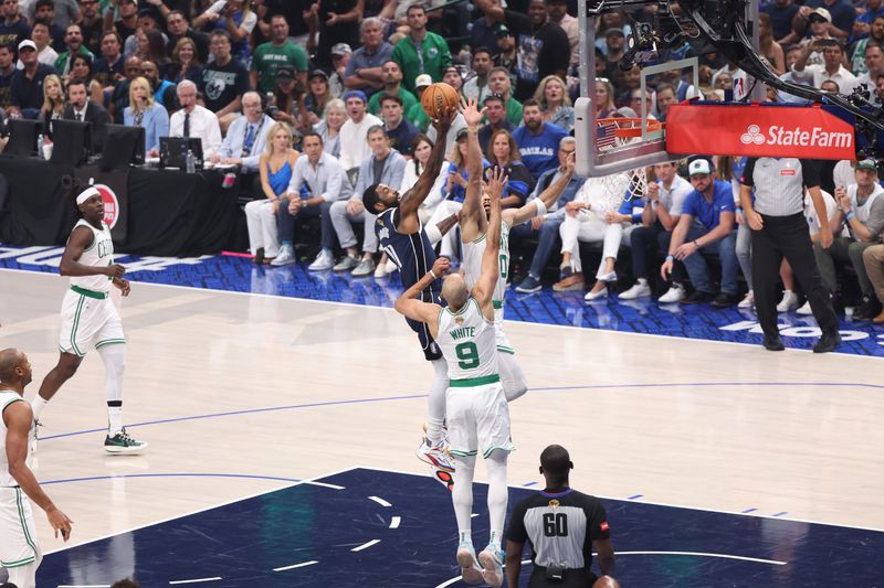 DALLAS, TX - JUNE 14: Kyrie Irving #11 of the Dallas Mavericks shoots the ball during the game against the Boston Celtics during Game 4 of the 2024 NBA Finals on June 14, 2024 at the American Airlines Center in Dallas, Texas. NOTE TO USER: User expressly acknowledges and agrees that, by downloading and or using this photograph, User is consenting to the terms and conditions of the Getty Images License Agreement. Mandatory Copyright Notice: Copyright 2024 NBAE (Photo by Joe Murphy/NBAE via Getty Images)