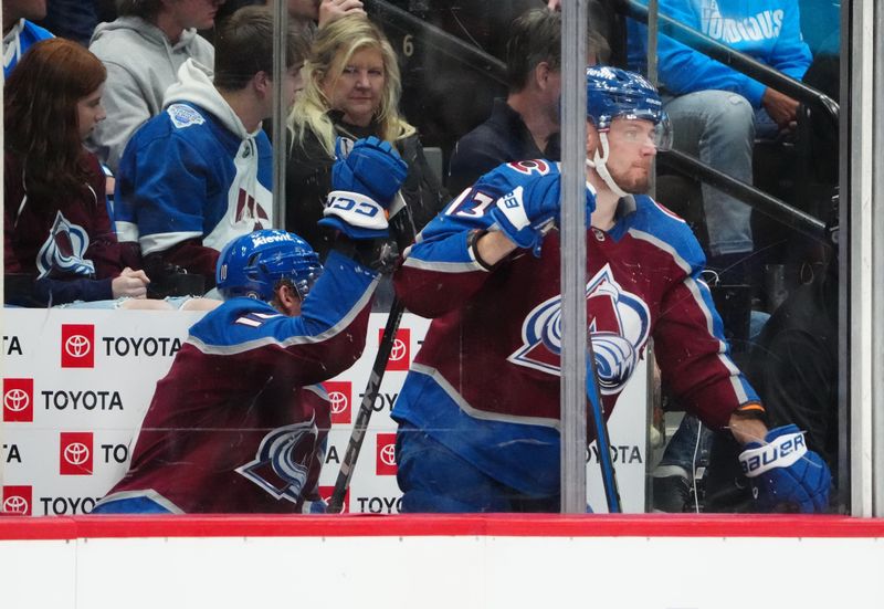 Nov 22, 2023; Denver, Colorado, USA; Colorado Avalanche right wing Valeri Nichushkin (13) and defenseman Riley Tufte (10) inside the penalty box during the second period against the Vancouver Canucks at Ball Arena. Mandatory Credit: Ron Chenoy-USA TODAY Sports