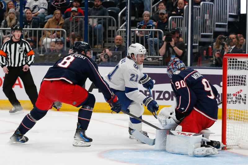 Feb 10, 2024; Columbus, Ohio, USA; Columbus Blue Jackets goalie Elvis Merzlikins (90) makes a save on the shot from Tampa Bay Lightning center Brayden Point (21) during the first period at Nationwide Arena. Mandatory Credit: Russell LaBounty-USA TODAY Sports