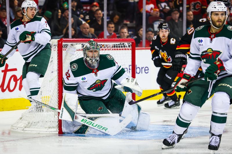 Dec 4, 2025; Calgary, Alberta, CAN; Minnesota Wild goaltender Filip Gustavsson (32) guards his net against the Calgary Flames during the second period at Scotiabank Saddledome. Mandatory Credit: Sergei Belski-Imagn Images
