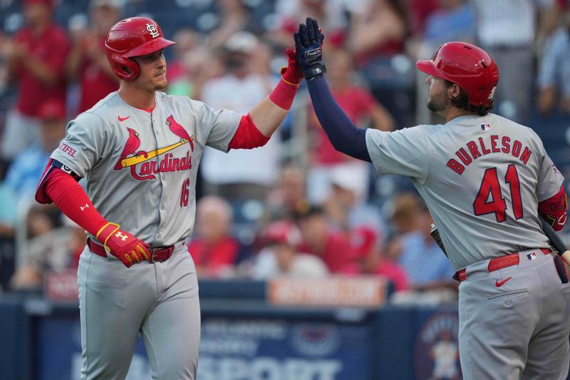 Mar 8, 2024; West Palm Beach, Florida, USA; St. Louis Cardinals second baseman Nolan Gorman (16) is congratulated by designated hitter Alec Burleson (41) after hitting a two-run home run against the Washington Nationals in the first inning at CACTI Park of the Palm Beaches. Mandatory Credit: Jim Rassol-USA TODAY Sports