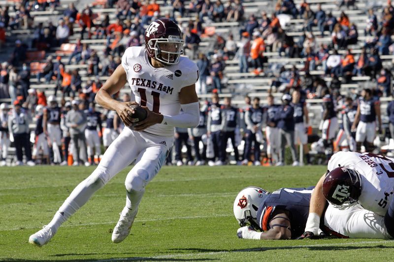 Dec 5, 2020; Auburn, Alabama, USA;  Texas A&M Aggies quarterback Kellen Mond (11) carries during the first quarter against the Auburn Tigers at Jordan-Hare Stadium. Mandatory Credit: John Reed-USA TODAY Sports