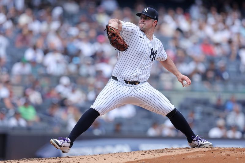 Jul 22, 2024; Bronx, New York, USA; New York Yankees starting pitcher Carlos Rodon (55) pitches against the Tampa Bay Rays during the second inning at Yankee Stadium. Mandatory Credit: Brad Penner-USA TODAY Sports