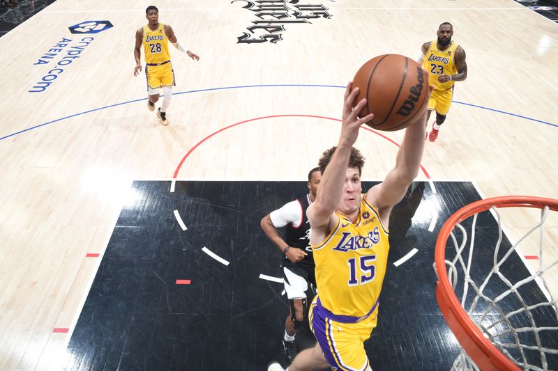 LOS ANGELES, CA - FEBRUARY 28: Austin Reaves #15 of the Los Angeles Lakers dunks the ball during the game against the LA Clippers on February 28, 2024 at Crypto.Com Arena in Los Angeles, California. NOTE TO USER: User expressly acknowledges and agrees that, by downloading and/or using this Photograph, user is consenting to the terms and conditions of the Getty Images License Agreement. Mandatory Copyright Notice: Copyright 2024 NBAE (Photo by Andrew D. Bernstein/NBAE via Getty Images)