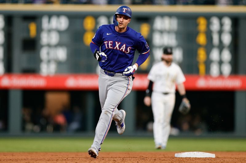 May 10, 2024; Denver, Colorado, USA; Texas Rangers shortstop Corey Seager (5) rounds the bases on a solo home run in the sixth inning against the Colorado Rockies at Coors Field. Mandatory Credit: Isaiah J. Downing-USA TODAY Sports