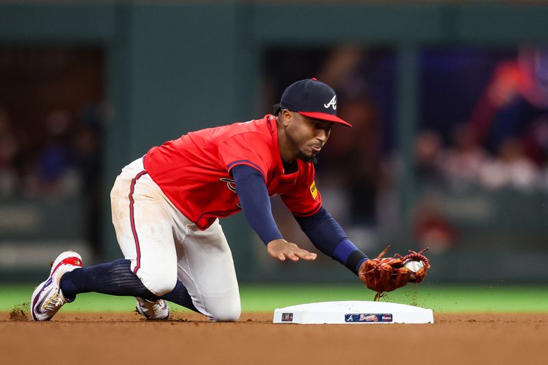 Sep 27, 2024; Atlanta, Georgia, USA; Atlanta Braves second baseman Ozzie Albies (1) forces a runner out at second against the Kansas City Royals in the fourth inning at Truist Park. Mandatory Credit: Brett Davis-Imagn Images
