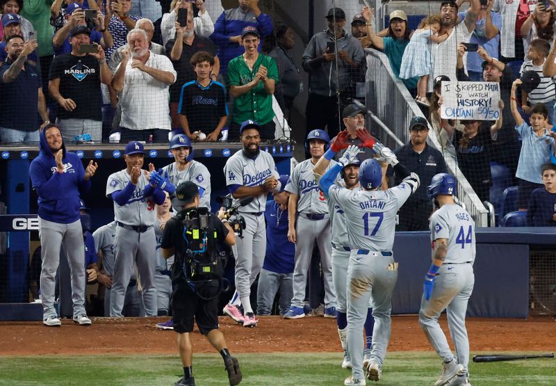Sep 19, 2024; Miami, Florida, USA; Los Angeles Dodgers designated hitter Shohei Ohtani (17) celebrates after hitting his 50th home run of the season against the Miami Marlins during the seventh inning at loanDepot Park. Mandatory Credit: Rhona Wise-Imagn Images