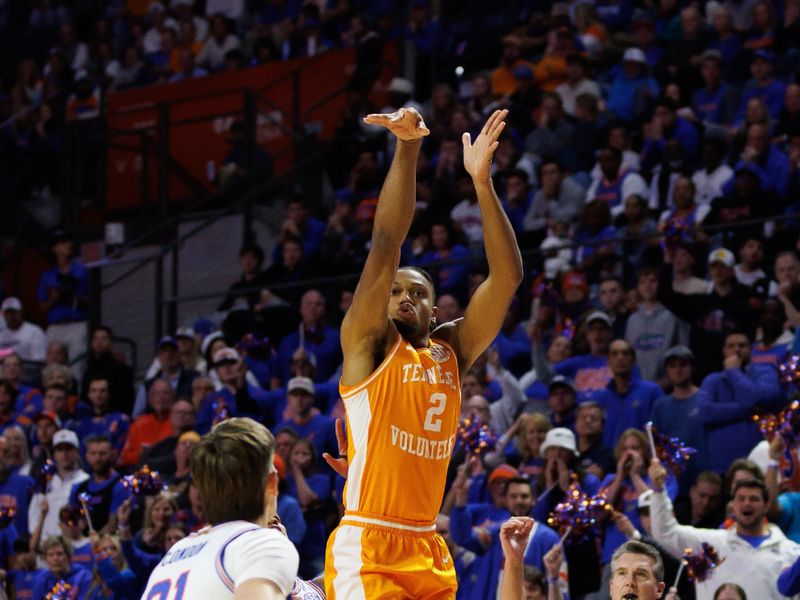 Jan 7, 2025; Gainesville, Florida, USA; Tennessee Volunteers guard Chaz Lanier (2) attempts a three point basket over Florida Gators guard Will Richard (5) and Florida Gators forward Alex Condon (21) during the first half at Exactech Arena at the Stephen C. O'Connell Center. Mandatory Credit: Matt Pendleton-Imagn Images