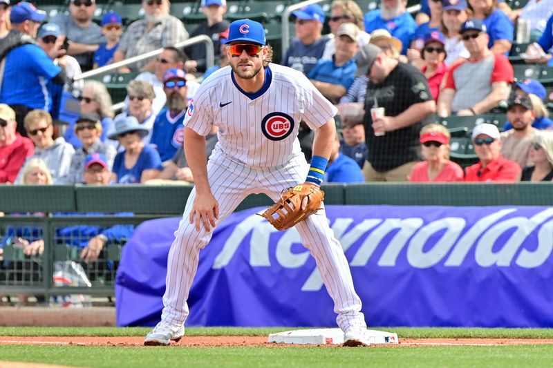 Feb 27, 2024; Mesa, Arizona, USA;  Chicago Cubs third baseman Patrick Wisdom (16) defends in the first inning Cincinnati Reds during a spring training game at Sloan Park. Mandatory Credit: Matt Kartozian-USA TODAY Sports