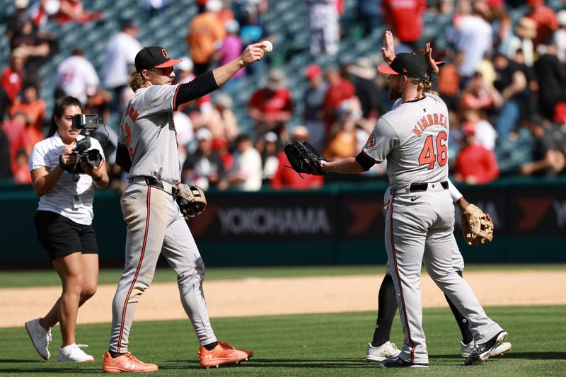 Apr 24, 2024; Anaheim, California, USA;  Baltimore Orioles shortstop Gunnar Henderson (2) hands a game ball to relief pitcher Craig Kimbrel (46) after defeating the Los Angeles Angels 6-5 at Angel Stadium. Mandatory Credit: Kiyoshi Mio-USA TODAY Sports