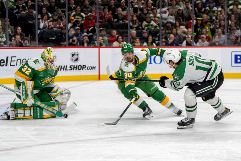 Nov 16, 2024; Saint Paul, Minnesota, USA; Minnesota Wild goaltender Filip Gustavsson (32) stops a shot by Dallas Stars center Oskar Back (10) as Minnesota enter Marcus Johansson (90) assists in the second period at Xcel Energy Center. Mandatory Credit: Matt Blewett-Imagn Images