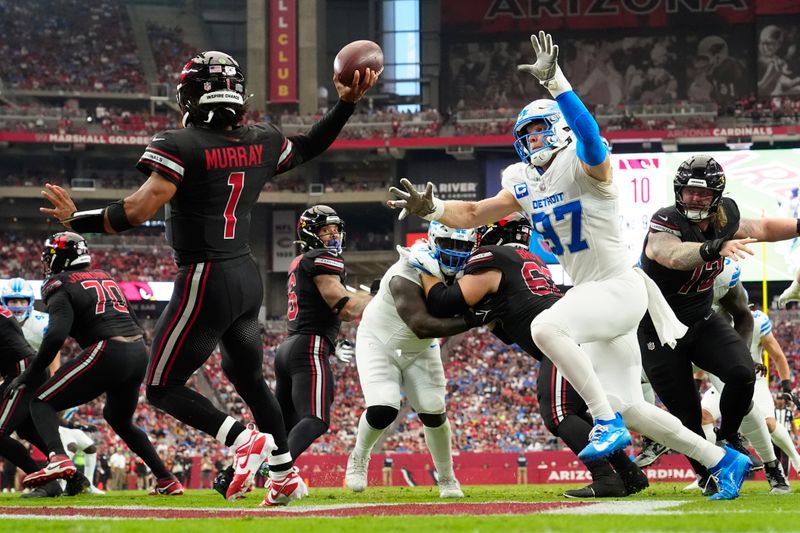 Detroit Lions defensive end Aidan Hutchinson (97) applies pressure to Arizona Cardinals quarterback Kyler Murray (1) during the second half of an NFL football game Sunday, Sept. 22, 2024, in Glendale, Ariz. (AP Photo/Ross D. Franklin)