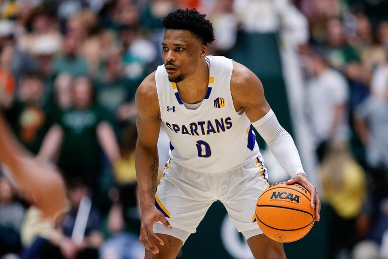 Feb 9, 2024; Fort Collins, Colorado, USA; San Jose State Spartans guard Myron Amey Jr. (0) controls the ball in the first half against the Colorado State Rams at Moby Arena. Mandatory Credit: Isaiah J. Downing-USA TODAY Sports