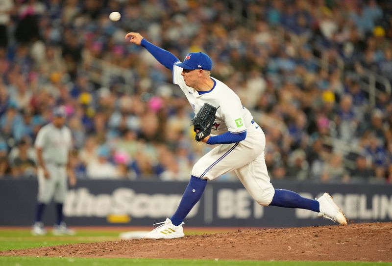 Jul 26, 2024; Toronto, Ontario, CAN; Toronto Blue Jays pitcher Chad Green (57) pitches to the Texas Rangers during the ninth inning at Rogers Centre. Mandatory Credit: John E. Sokolowski-USA TODAY Sports