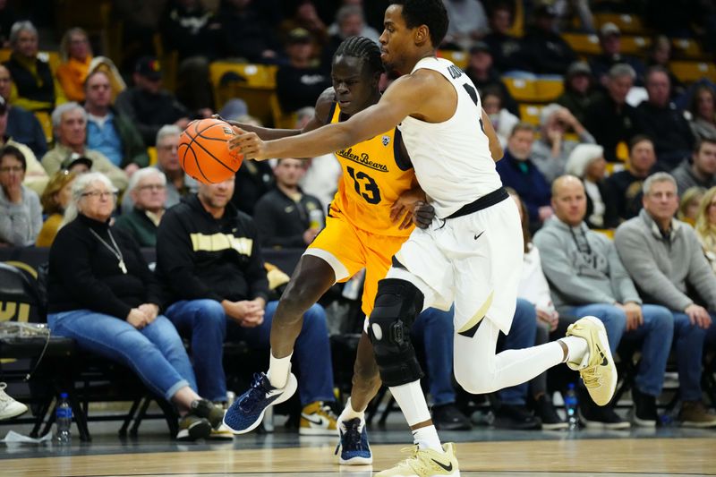 Feb 2, 2023; Boulder, Colorado, USA; California Golden Bears forward Kuany Kuany (13) drives at Colorado Buffaloes guard Jalen Gabbidon (3) in the second half at the CU Events Center. Mandatory Credit: Ron Chenoy-USA TODAY Sports