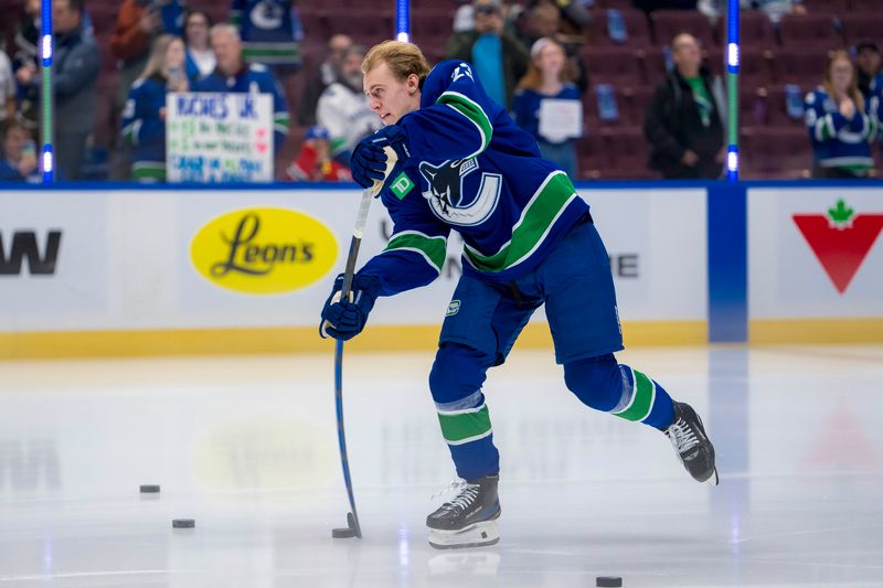 Nov 12, 2024; Vancouver, British Columbia, CAN; Vancouver Canucks forward Jonathan Lekkerimaki (23) warms up before his NHL debut against the Calgary Flames at Rogers Arena. Mandatory Credit: Bob Frid-Imagn Images