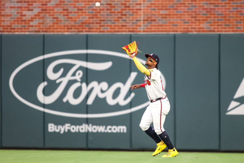 Apr 6, 2024; Atlanta, Georgia, USA; Atlanta Braves right fielder Ronald Acuna Jr. (13) catches a fly ball against the Arizona Diamondbacks in the third inning at Truist Park. Mandatory Credit: Brett Davis-USA TODAY Sports