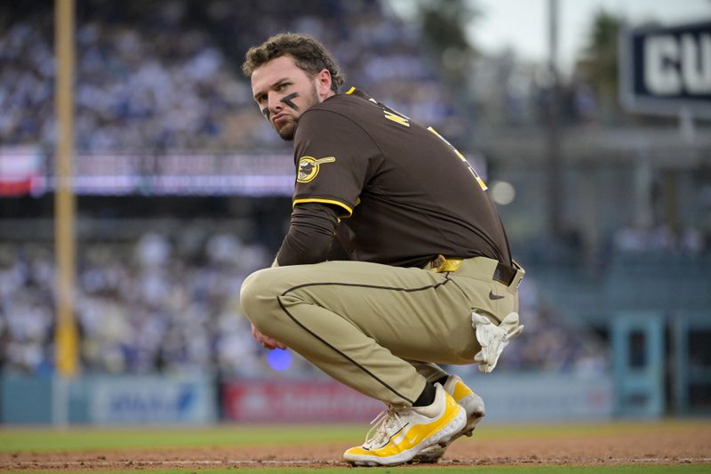 Oct 11, 2024; Los Angeles, California, USA; San Diego Padres outfielder Jackson Merrill (3) looks on in the fourth inning against the Los Angeles Dodgers during game five of the NLDS for the 2024 MLB Playoffs at Dodger Stadium. Mandatory Credit: Jayne Kamin-Oncea-Imagn Images