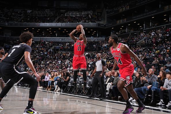 BROOKLYN, NY - NOVEMBER 26: DeMar DeRozan #11 of the Chicago Bulls shoots a three point basket against the Brooklyn Nets on November 26, 2023 at Barclays Center in Brooklyn, New York. NOTE TO USER: User expressly acknowledges and agrees that, by downloading and or using this Photograph, user is consenting to the terms and conditions of the Getty Images License Agreement. Mandatory Copyright Notice: Copyright 2023 NBAE (Photo by Jesse D. Garrabrant/NBAE via Getty Images)