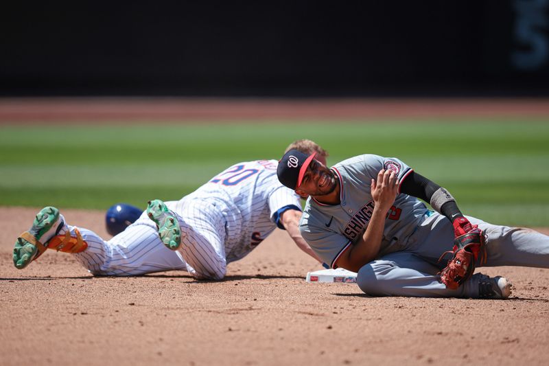 Jul 11, 2024; New York City, New York, USA; Washington Nationals second baseman Luis Garcia Jr. (2) reacts after tagging out New York Mets first baseman Pete Alonso (20) at second base during the fifth inning at Citi Field. Mandatory Credit: Vincent Carchietta-USA TODAY Sports