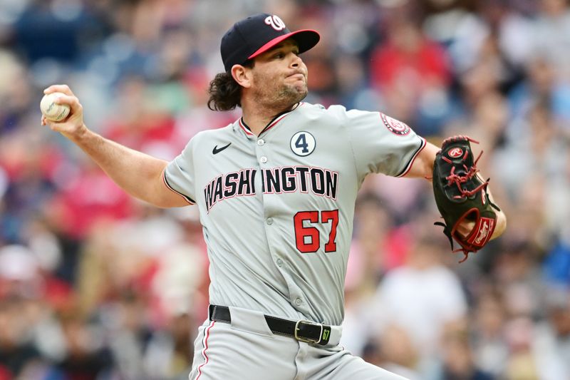 Jun 2, 2024; Cleveland, Ohio, USA; Washington Nationals relief pitcher Kyle Finnegan (67) throws a pitch during the ninth inning against the Cleveland Guardians at Progressive Field. Mandatory Credit: Ken Blaze-USA TODAY Sports