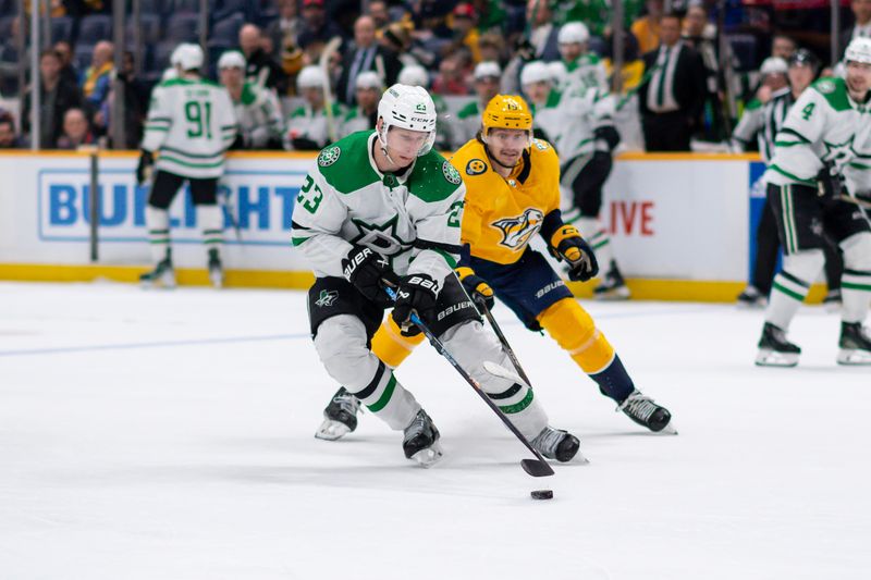 Feb 15, 2024; Nashville, Tennessee, USA; Dallas Stars defenseman Esa Lindell (23) skates with the puck  during the third period at Bridgestone Arena. Mandatory Credit: Steve Roberts-USA TODAY Sports