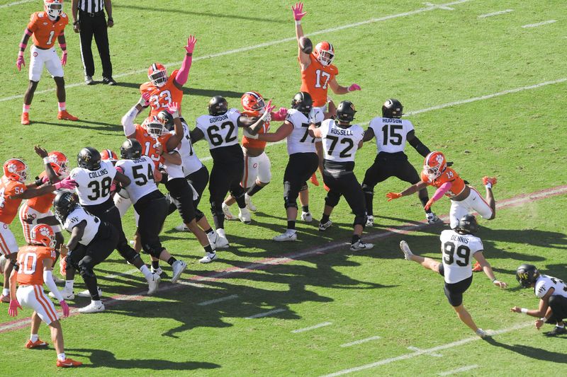 Oct 7, 2023; Clemson, South Carolina, USA; Wake Forest kicker Matthew Dennis (99) kicks a field goal against Clemson during the first quarter at Memorial Stadium. Mandatory Credit: Ken Ruinard-USA TODAY Sports