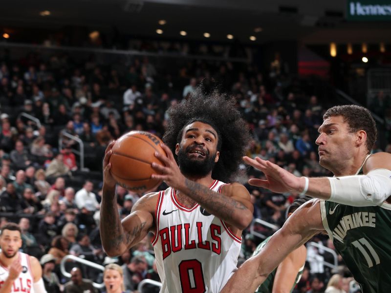 MILWAUKEE, WI - NOVEMBER 20: Coby White #0 of the Chicago Bulls drives to the basket during the game against the Milwaukee Bucks on November 20, 2024 at the Fiserv Forum Center in Milwaukee, Wisconsin. NOTE TO USER: User expressly acknowledges and agrees that, by downloading and or using this Photograph, user is consenting to the terms and conditions of the Getty Images License Agreement. Mandatory Copyright Notice: Copyright 2024 NBAE (Photo by Gary Dineen/NBAE via Getty Images).