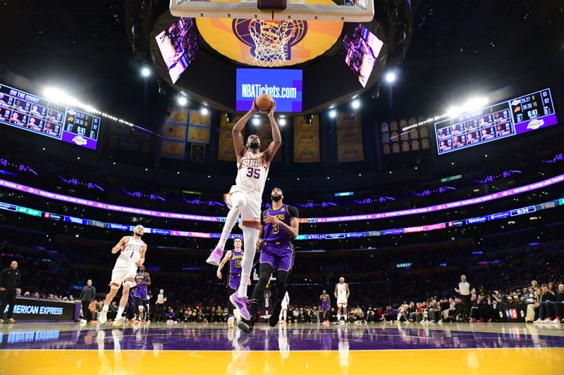 LOS ANGELES, CA - JANUARY 11: (EDITORS NOTE: Sequence 1 of 4) Kevin Durant #35 of the Phoenix Suns dunks the ball during the game against the Los Angeles Lakers on January 11, 2024 at Crypto.Com Arena in Los Angeles, California. NOTE TO USER: User expressly acknowledges and agrees that, by downloading and/or using this Photograph, user is consenting to the terms and conditions of the Getty Images License Agreement. Mandatory Copyright Notice: Copyright 2024 NBAE (Photo by Adam Pantozzi/NBAE via Getty Images)