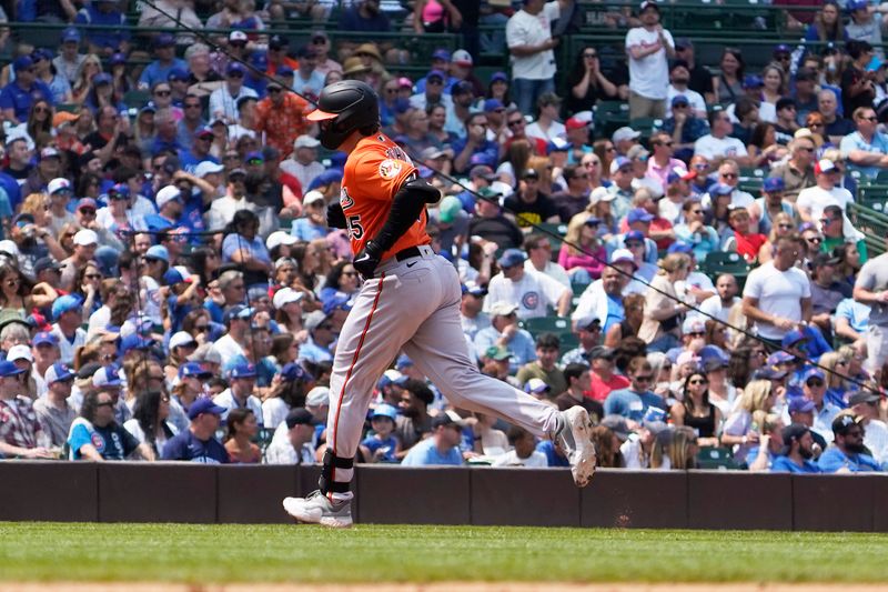 Jun 17, 2023; Chicago, Illinois, USA; Baltimore Orioles designated hitter  Adley Rutschman (35) runs the bases after hitting a home run against the Chicago Cubs during the fifth inning at Wrigley Field. Mandatory Credit: David Banks-USA TODAY Sports