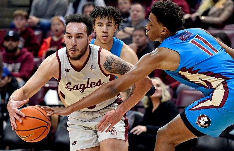 Feb 18, 2023; Tallahassee, Florida, USA; Boston College Eagles guard Jaeden Zackery (3) has the ball knocked away by Florida State Seminoles forward Baba Miller (11) during the second half at Donald L. Tucker Center. Mandatory Credit: Melina Myers-USA TODAY Sports