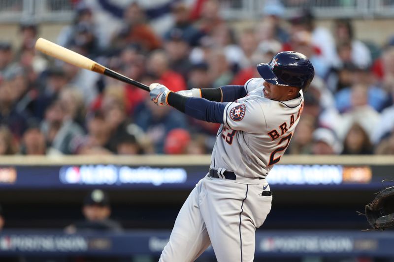 Oct 11, 2023; Minneapolis, Minnesota, USA; Houston Astros designated hitter Michael Brantley (23) hits as solo home-run in the second inning against the Minnesota Twins during game four of the ALDS for the 2023 MLB playoffs at Target Field. Mandatory Credit: Jesse Johnson-USA TODAY Sports